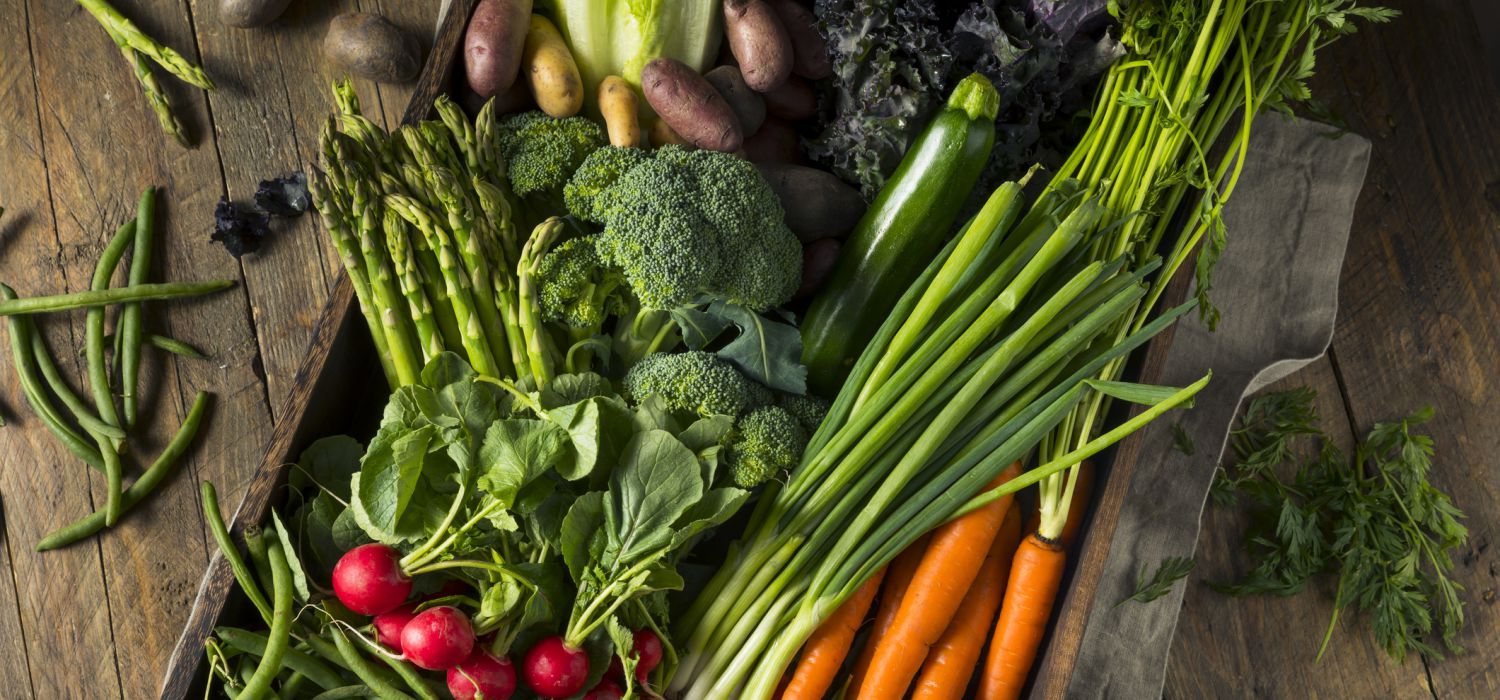 vegetables including carrot, cucumber, beans, broccoli spread on table