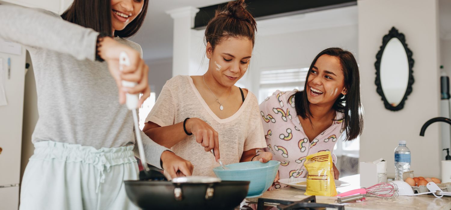 teenagers cooking and having fun