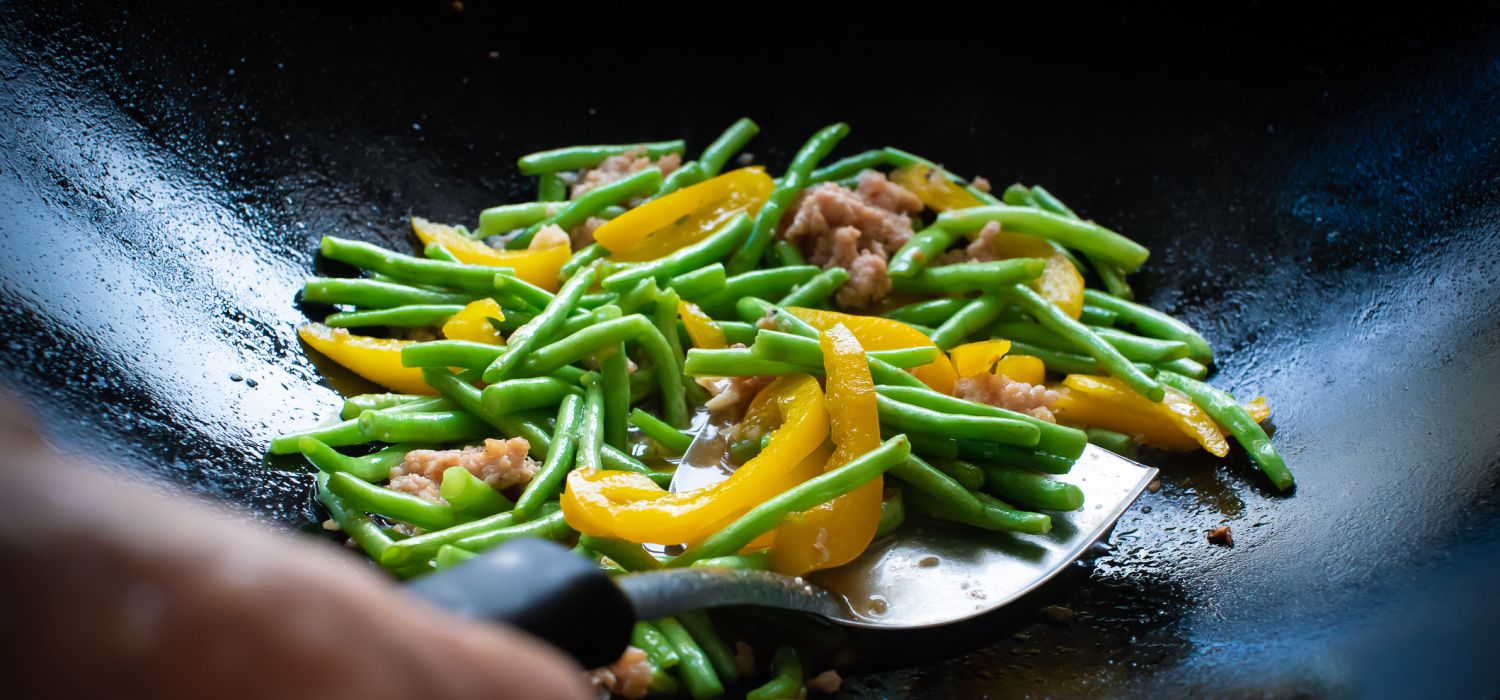 stir fry vegetable and beef in wok